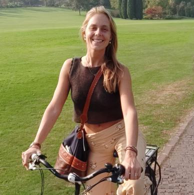 Elisa Lorenzetti on a bike in a park